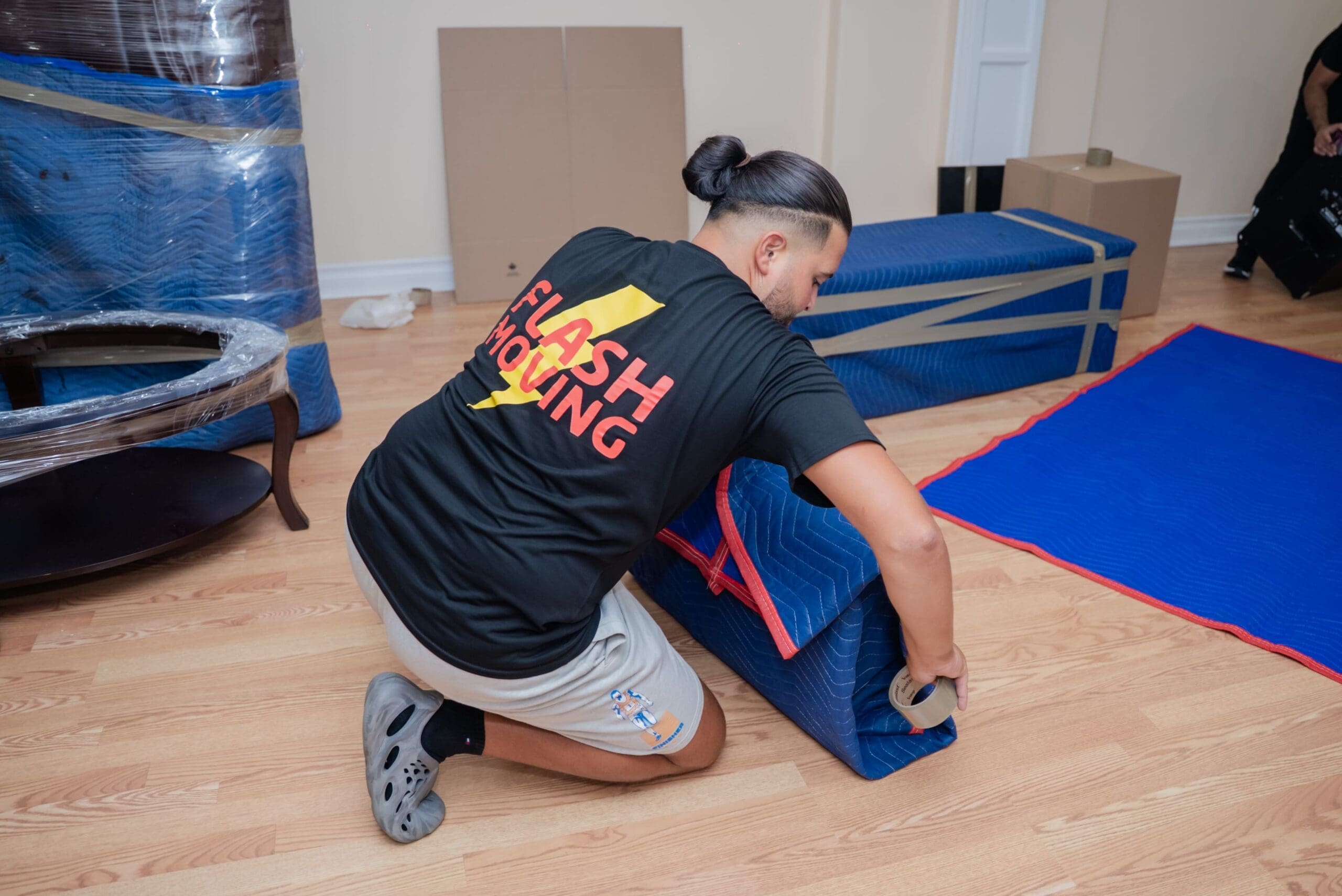 Flash Moving crew preparing furniture for a move in the GTA