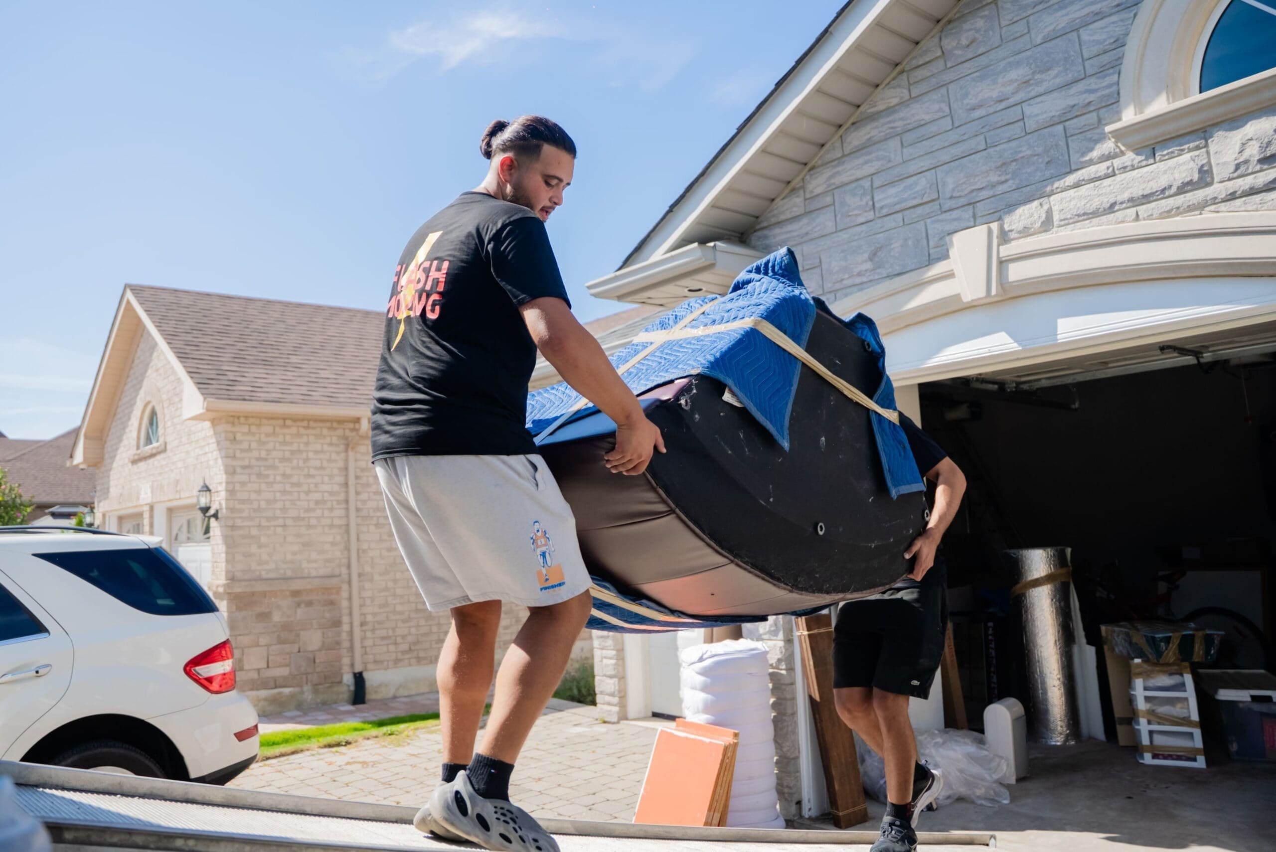 Flash Moving team loading a truck in a Brampton neighbourhood