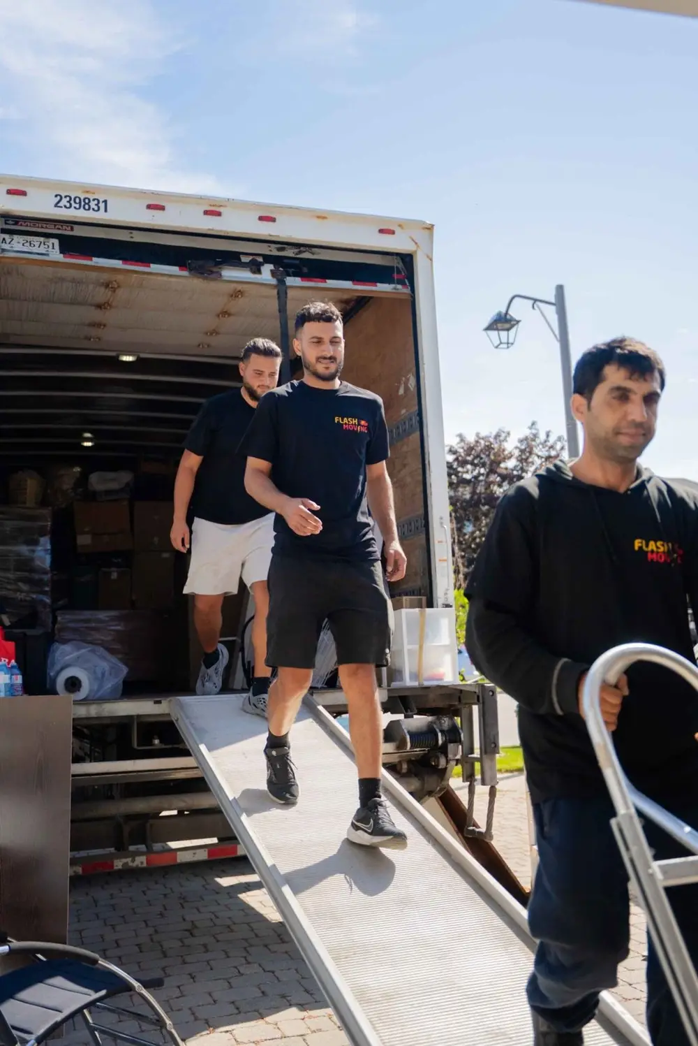 Flash Moving crew unloading a truck