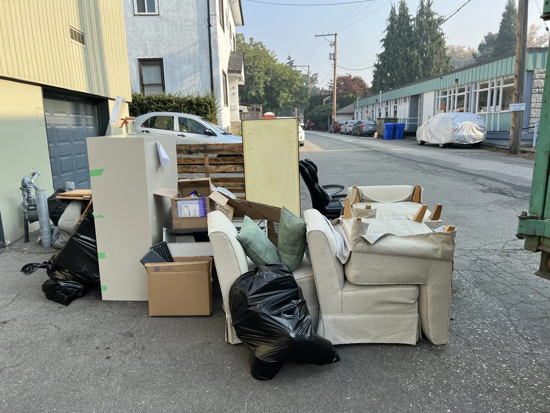 Old appliances and furniture being loaded for junk removal in Mississauga